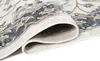 A close-up view of a rolled-up rug, showing its texture and pattern. Produktbild-Vorschau