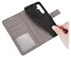 A hand is shown holding a black phone case, which is being inserted into a gray wallet-style phone case with card slots. Produktbild-Vorschau