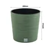 A green textured round planter pot with dimensions indicated. Produktbild-Vorschau