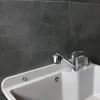 A close-up view of a chrome faucet and sink. Produktbild-Vorschau
