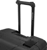 A close-up view of the handle and top section of a black suitcase. Podgląd zdjęcia produktu