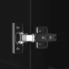A close-up view of a black cabinet hinge attached to a black surface. Náhľad obrázku produktu
