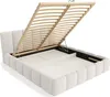 A white upholstered bed frame with its slatted mattress base lifted to reveal storage space underneath. Produktbild-Vorschau