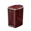 A red pedal trash can with a silver pedal and trim, shown against a white background. Produktbild-Vorschau