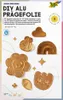 A flat lay of gold-colored DIY embossing foil cutouts in various shapes, arranged on a light-colored background with some decorative elements. Podgląd zdjęcia produktu