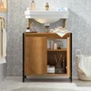 A bathroom vanity with a sink and cabinet, set against a tiled wall. Náhľad obrázku produktu