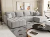 A modern living room with a large sectional sofa, coffee table, and artwork on the wall. Produktbild-Vorschau