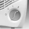 A close-up view of a white fan's control dial and part of its grille. Anteprima dell’immagine prodotto