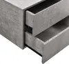 A close-up view of two open drawers of a nightstand with a concrete-like texture. Anteprima dell’immagine prodotto