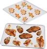 Two baking trays, one with Christmas cookies and the other with roasted meats. Produktbild-Vorschau