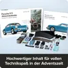 A collection of items related to a Porsche 911 Advent Calendar, including model cars, building components, and packaging. Náhľad obrázku produktu