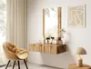 A modern vanity table with a mirror and chair in a bright room. Voir les images du produit