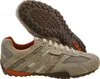 A pair of beige Geox sneakers shown from a slightly elevated side angle, with one shoe placed on top of the other, revealing the sole of the bottom shoe. Produktbild-Vorschau