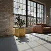 A modern living room with a large window, a leather sofa, and a decorative sculpture on a wooden pedestal. Produktbild-Vorschau