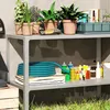 A storage shelf with gardening supplies and plants. Voir les images du produit