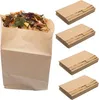 A full bag of compostable waste and stacks of compostable bags. Produktbild-Vorschau
