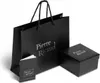 A black shopping bag, a small black box, and a small booklet, all branded with 'Pierre Ricaud'. Produktbild-Vorschau