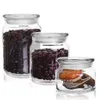 Three glass jars filled with different food items, arranged on a white background. Anteprima dell’immagine prodotto