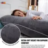 A woman sleeping on a large gray pillow, with a close-up inset showing the texture of the pillow's fabric. Náhled obrázku produktu