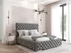 A bedroom with a large tufted bed, nightstand, and window. Produktbild-Vorschau