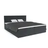 A dark gray upholstered box spring bed with two white pillows and a dark gray duvet, shown against a white background. Náhled obrázku produktu