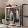 A light wood wardrobe organizer with clothes hanging and folded items on shelves, next to a potted plant and a door. Náhľad obrázku produktu