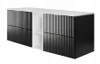 A modern black and white vanity unit with ribbed drawer fronts and a white countertop. Voir les images du produit