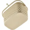 A close-up, angled view of a beige laundry clip basket. Podgląd zdjęcia produktu