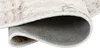 Close-up view of the underside and edge of a rolled-up rug. Produktbild-Vorschau