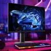 A gaming monitor displaying a futuristic spaceship, placed on a desk with a keyboard. Produktbild-Vorschau