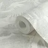 A roll of wallpaper with a palm leaf pattern. Produktbild-Vorschau