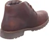 A brown leather boot with fur lining. Voir les images du produit