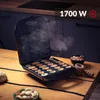 A waffle maker filled with small waffles, with a bowl of nuts and a wooden tool on a wooden table. Voir les images du produit