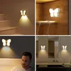 Collage of four images showing butterfly-shaped night lights in different home settings. Produktbild-Vorschau