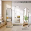 Three arched floor mirrors are displayed in a room setting, showcasing different placement options: leaning against a wall, mounted on a wall, and freestanding with a stand. The mirrors reflect parts of a living room and a chair. Produktbild-Vorschau