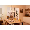 A dining room with a chandelier, dining table, chairs, and kitchen area. Anteprima dell’immagine prodotto