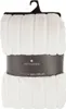 A white faux fur blanket is rolled up and presented on a hanger. Podgląd zdjęcia produktu