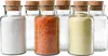 Several glass jars with cork stoppers are lined up, some filled with different spices or ingredients. Produktbild-Vorschau