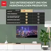 A comparison table highlighting the features of a RED OPTICUM AX 300 VFD receiver against conventional products, displayed above a modern television set showing a city skyline. Produktbild-Vorschau