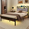 A bedroom scene featuring a bed with a headboard and storage, illuminated by LED lights. Náhled obrázku produktu