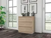 A chest of drawers is placed next to a large window in a room with dark wooden floors. Podgląd zdjęcia produktu