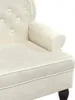 Close-up view of a cream-colored armchair. Náhled obrázku produktu