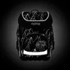 A black backpack with a lightning bolt pattern and reflective accents, set against a dark background. Náhled obrázku produktu
