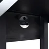A close-up view of a black grill with a silver circular component attached to the underside. Produktbild-Vorschau
