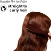 A close-up shot of a person brushing their long, auburn hair with a brown hairbrush. Anteprima dell’immagine prodotto