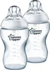 Two clear baby bottles with white nipples and caps, placed side-by-side against a white background. Produktbild-Vorschau