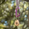 Produktfoto von "Mono" von YY Vertical; ein Klettergriff mit einem Karabiner und einer Schnur im Hintergrund. Produktbild-Vorschau