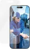 A person is leaning against a pole, with a phone screen showing a reflection of the person and the surroundings. Produktbild-Vorschau