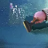 A hand is using an ice scraper to remove ice from a car windshield. Náhled obrázku produktu