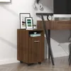 A brown wooden filing cabinet with wheels is shown in a room. Náhľad obrázku produktu